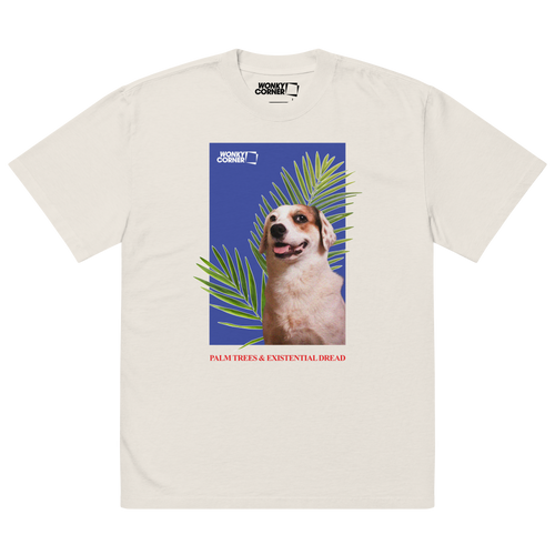 valkoinen t-paita, jossa printtinä läähättävä koira ja palmunoksia sinisellä taustalla, kuvan alla teksti palms trees & existential dread
